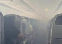 CA403機(jī)艙冒濃煙致9人輕傷 艙口打開(kāi)了應(yīng)急滑梯疏散乘客們
